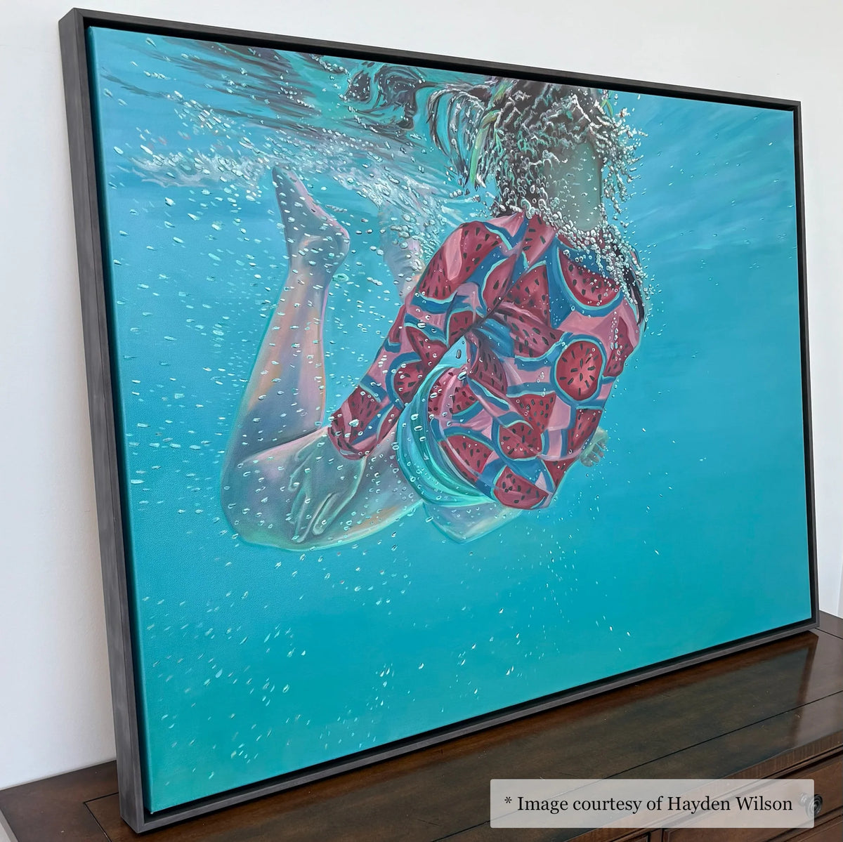 Realist figurative artwork by Hayden Wilson, framed in ebonized wood floater frame (Kiawah) from Gallery Unknown. Depicts a [describe the figure's action/pose/subject - e.g., woman reading a book].