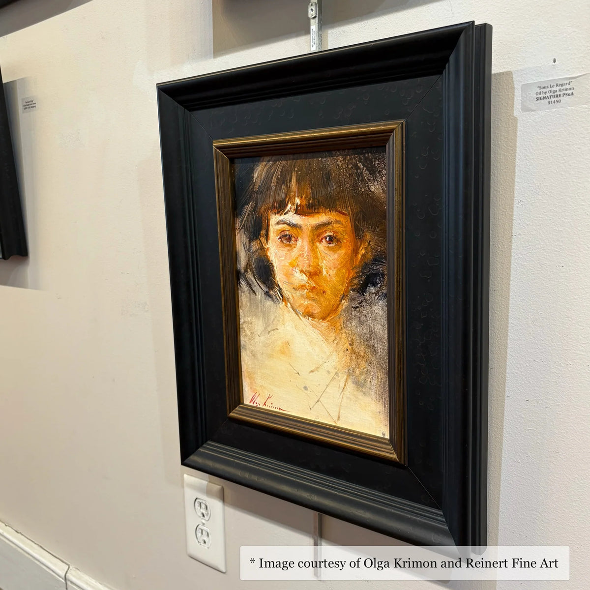 Impressionist portrait by Olga Krimon, framed in a wide black and gold frame, at Reinert Fine Art.
