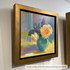 Impressionist floral artwork by Patricia Fylstra, framed in a wide gold floater frame, displayed at Perspective Gallery.