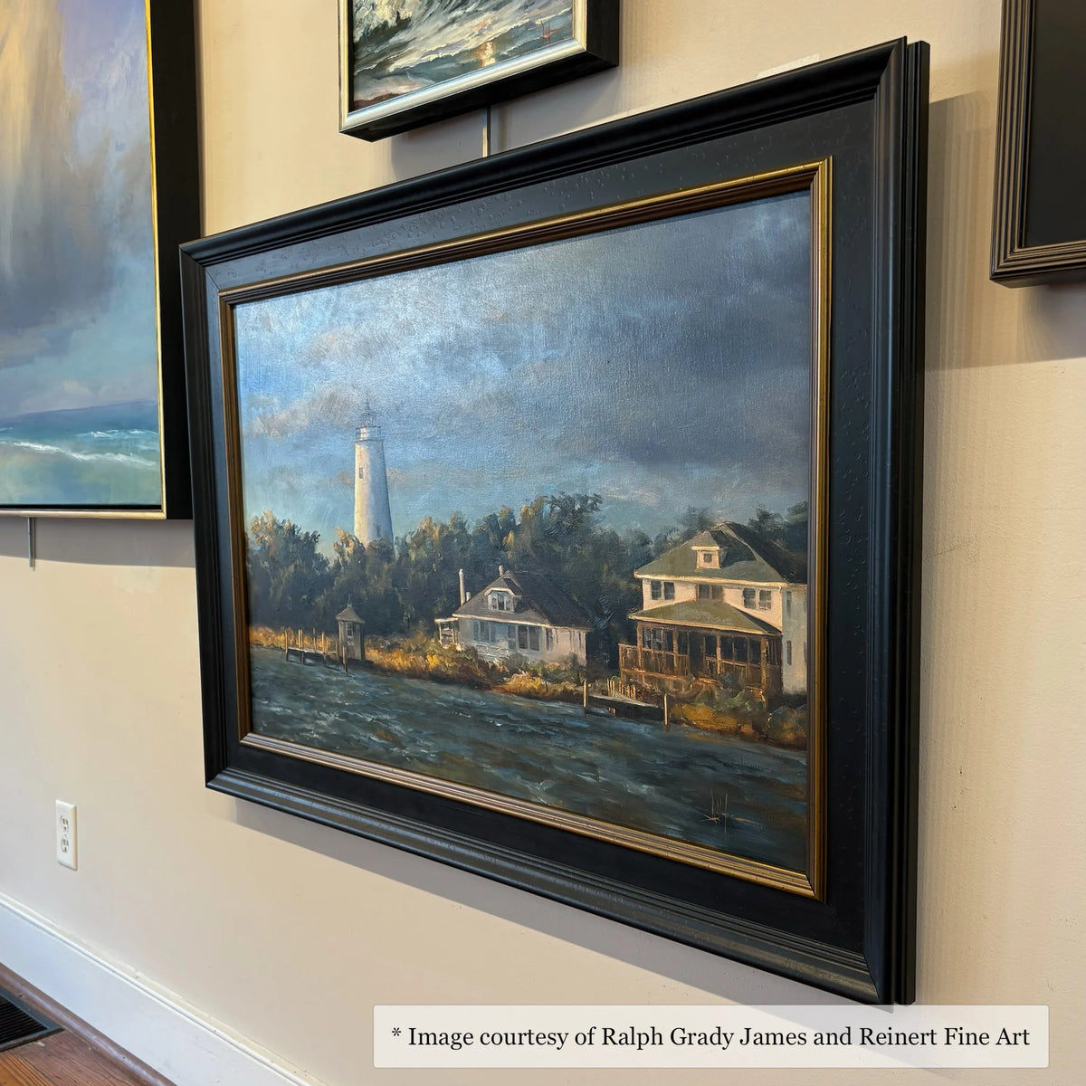 Coastal landscape painting by Ralph Grady James, displayed in a wide black and gold frame at Reinert Fine Art. Contemporary style.