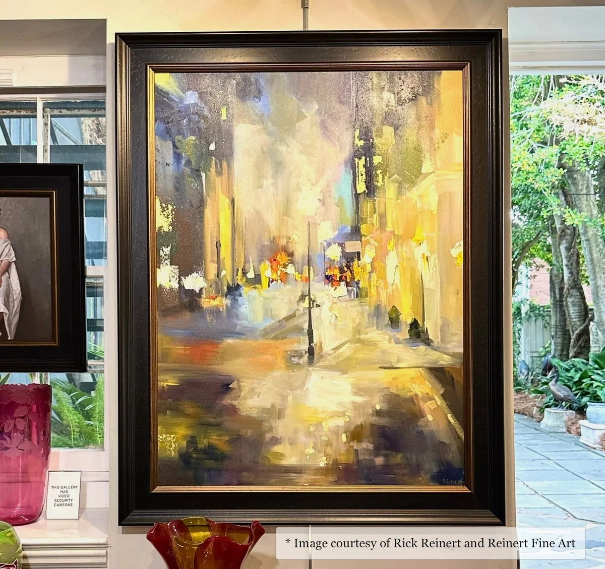 Impressionist urban landscape painting by Rick Reinert at Reinert Fine Art, framed in a wide black and gold frame. Subject: City scene.