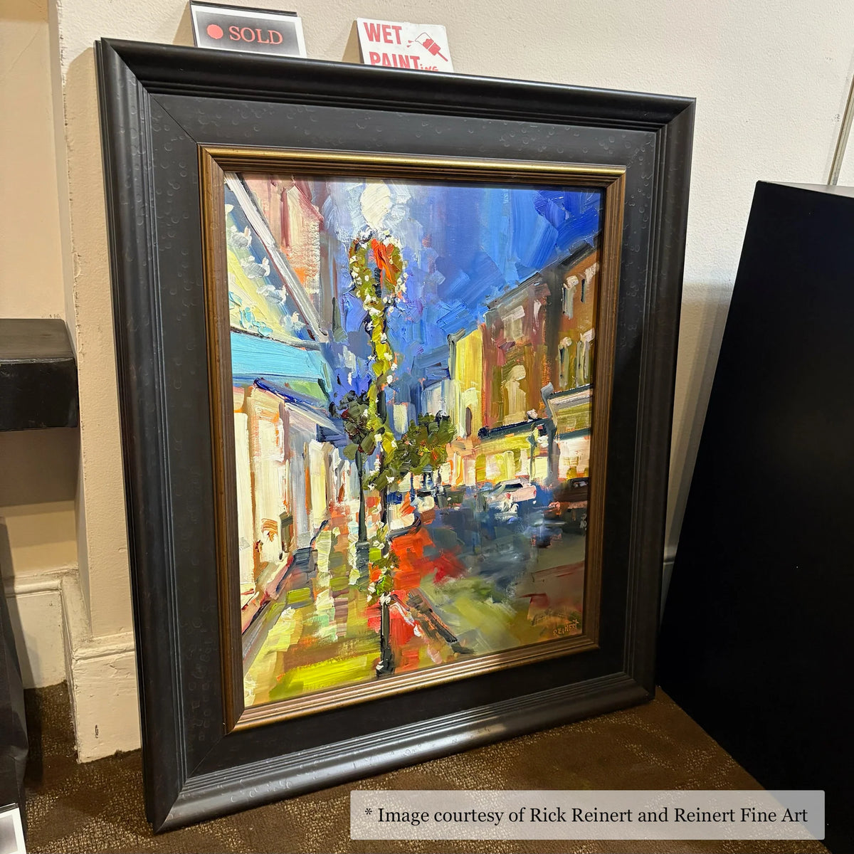 Impressionist urban landscape painting by Rick Reinert at Reinert Fine Art, framed in a wide black and gold frame. Subject matter features city scenes.